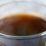 Warm coffee in clear glass mug