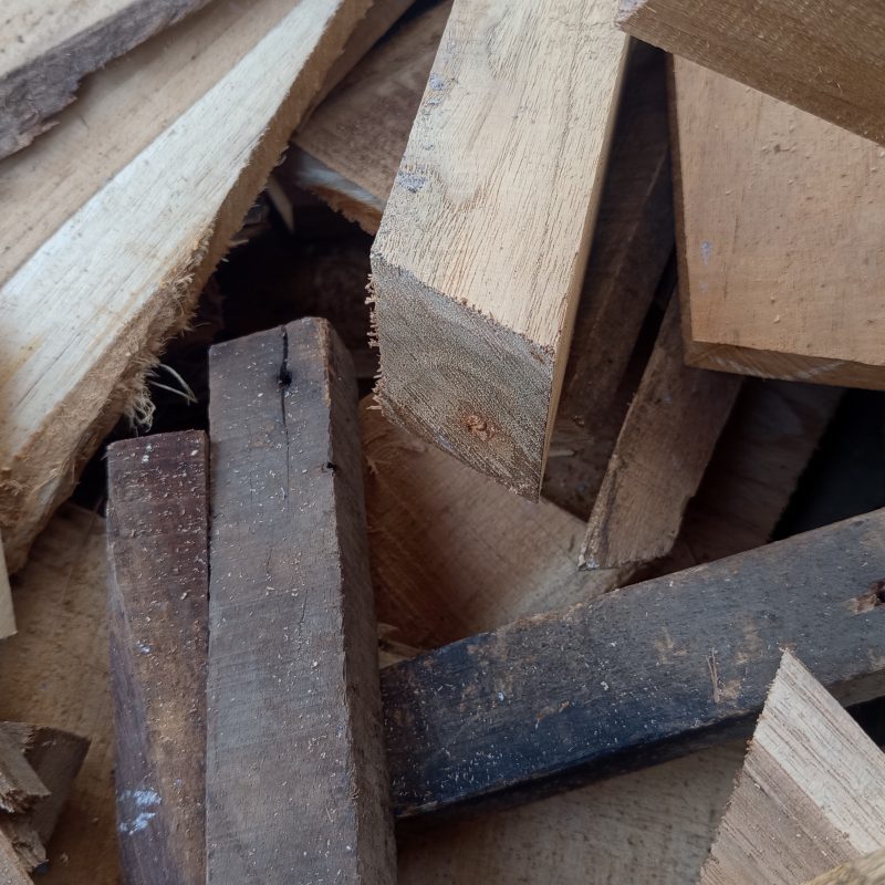 Wooden planks pile high, raw and unpolished