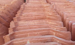 Rows of terracotta tiles stretch into the distance