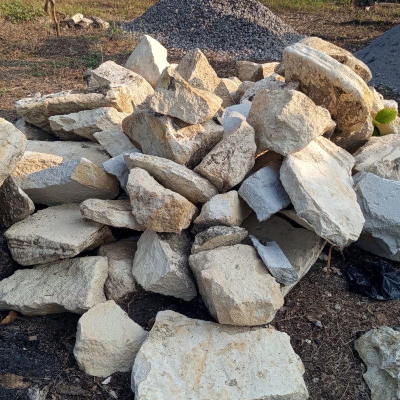 Stacked rocks rest on rough earth