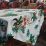 Tropical tablecloth drapes a wooden table